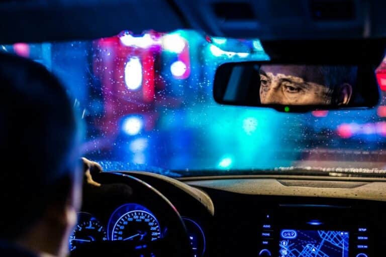 reflective-photo-of-man-in-rearview-mirror